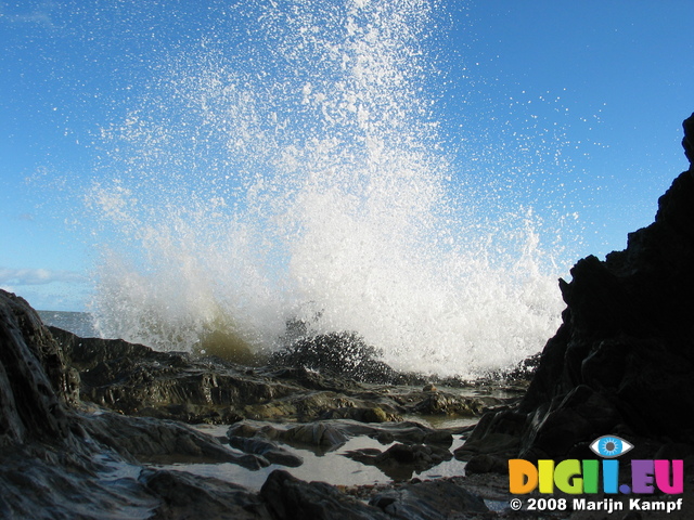 24248 Spray of waves splashing on rocks